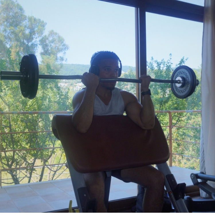 Ben performing a preacher curl